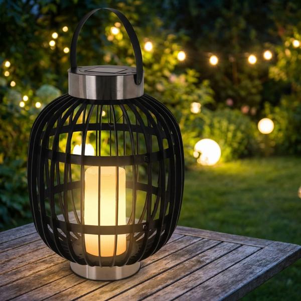 Élégante lanterne de jardin solaire aspect rotin : anneaux en acier inoxydable, bougie LED, 35x45 cm, noir – éclairage décoratif extérieur